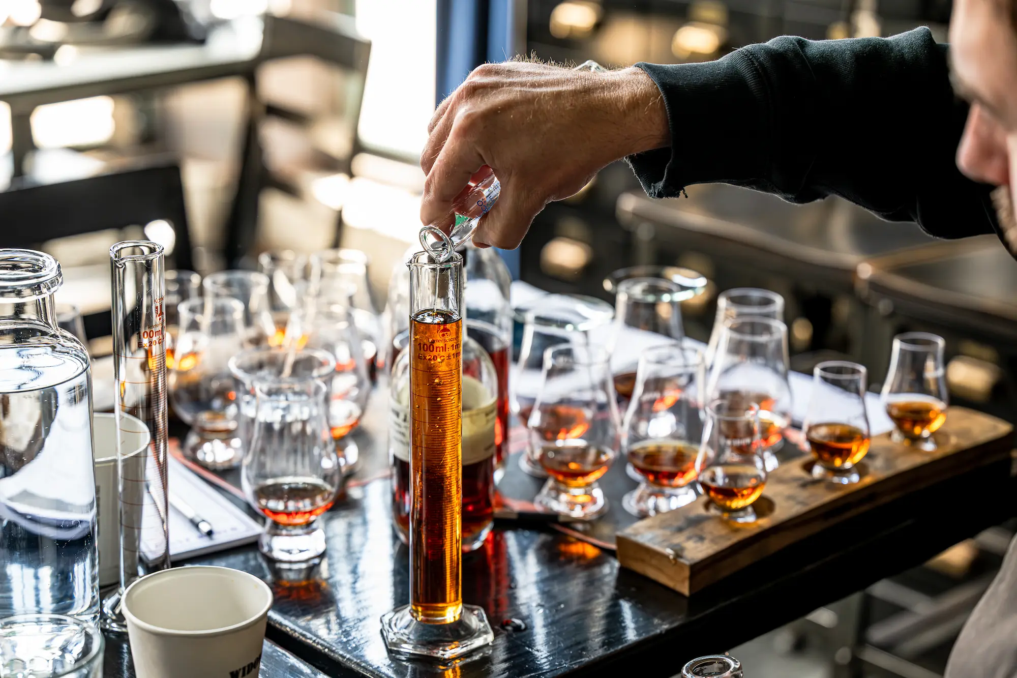 Pouring Borough Blend into a 100ml graduated cylinder